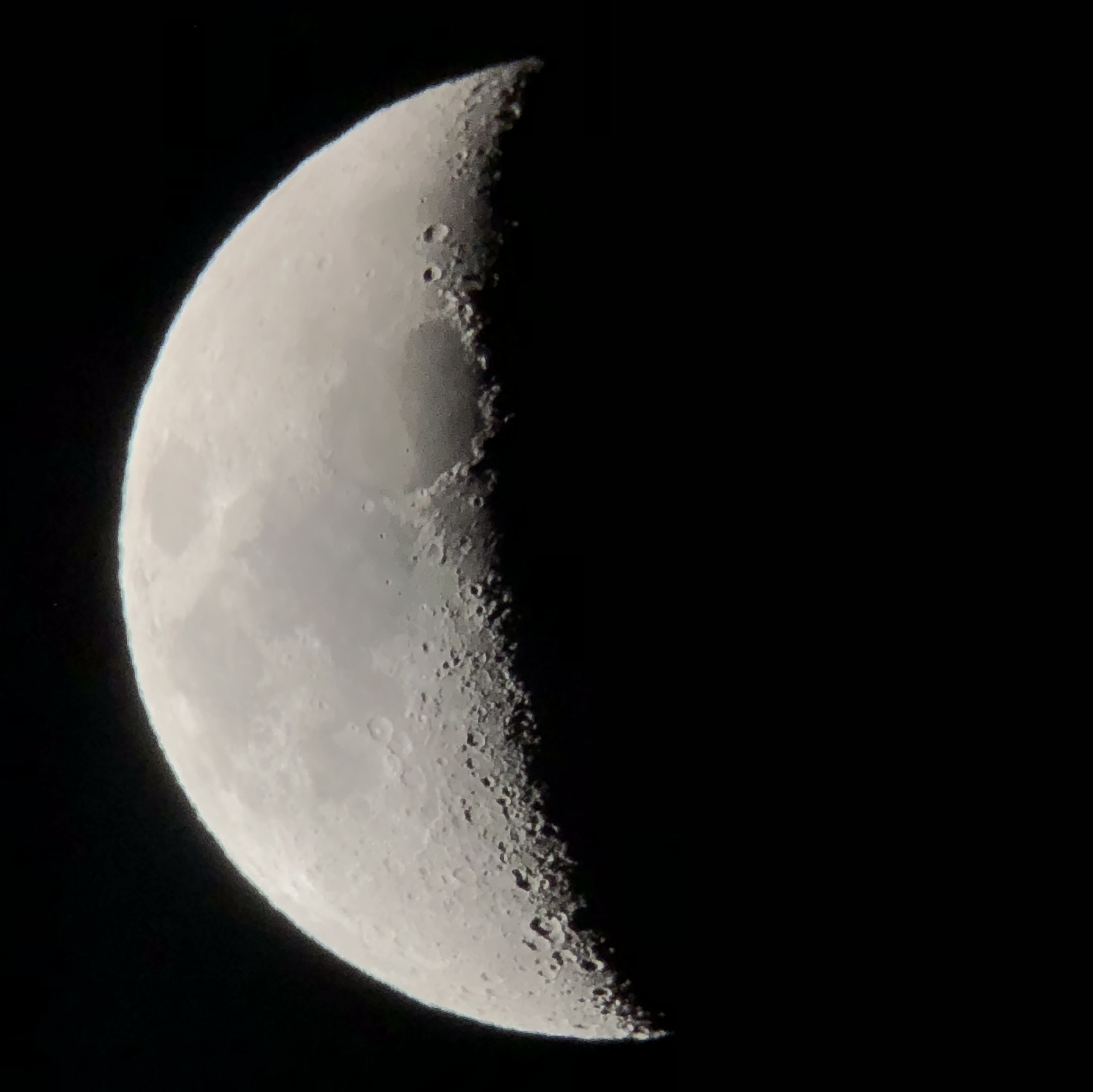 Earth's moon, waxing crescent, about 33% full